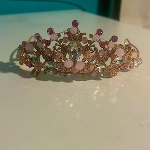 This is a children’s to teens tiaras, pink and gold, never worn